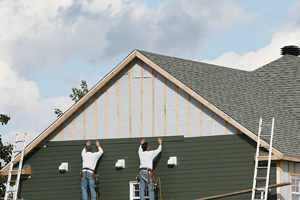 Professional Storm Damage Siding Repair technician working in Westchester, FL